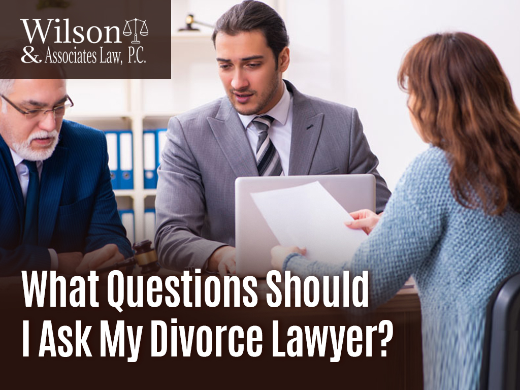 A woman asking questions to her divorce lawyer