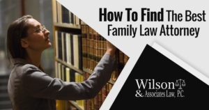Photo of a woman selecting a book from a shelf and the text: How to Find the Best Family Law Attorney